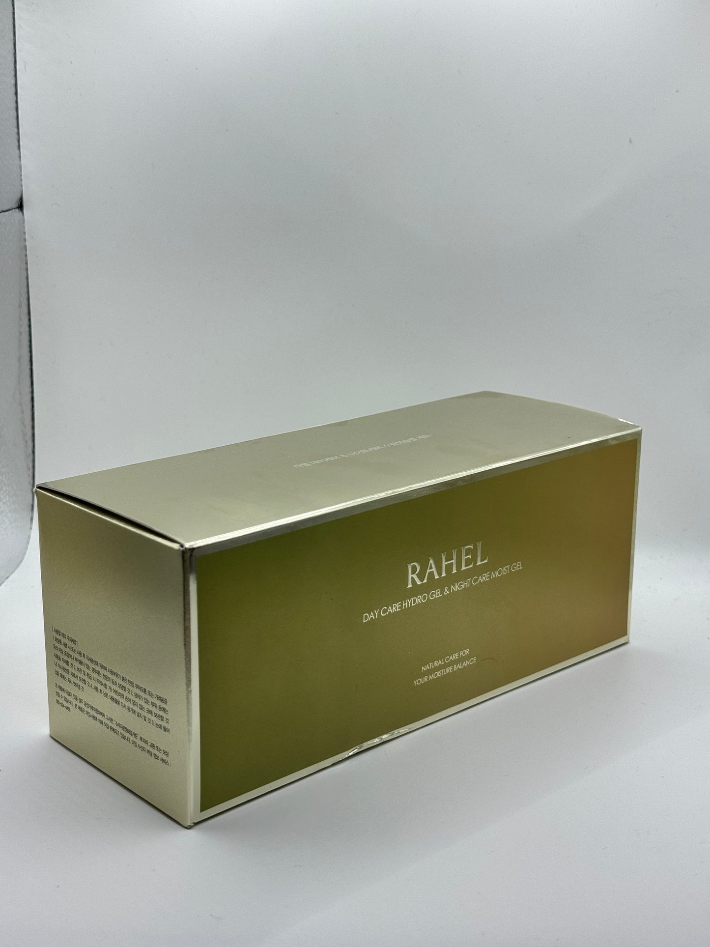 Gold box with 'RAHEL' branding on a white background